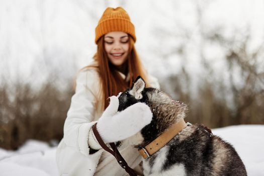 woman with a purebred dog winter walk outdoors friendship Lifestyle. High quality photo