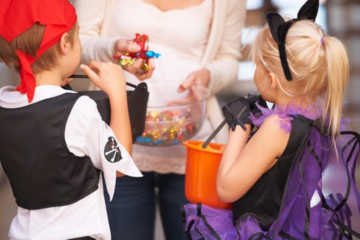 Shot of children trick or treating.