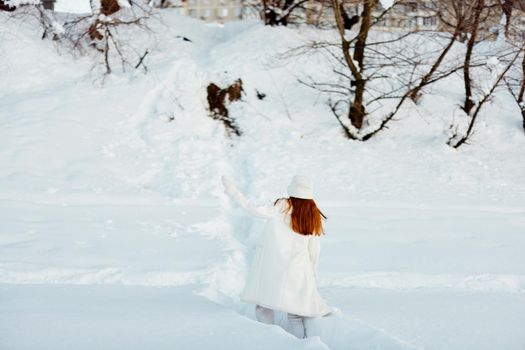 beautiful woman smile Winter mood walk white coat Lifestyle. High quality photo