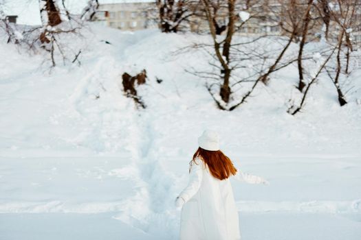 young woman winter clothes walk snow cold vacation nature. High quality photo