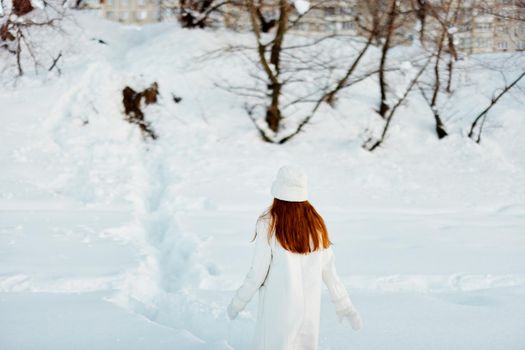 beautiful woman winter weather snow posing nature rest travel. High quality photo