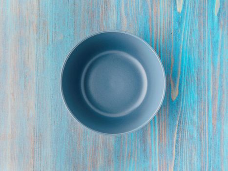 empty ceramic bowl for soup on the old wood turquoise table