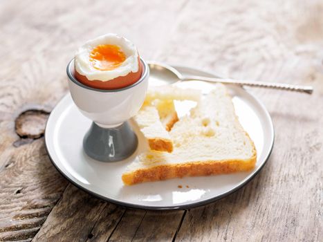 soft boiled egg in Cup on a wooden table