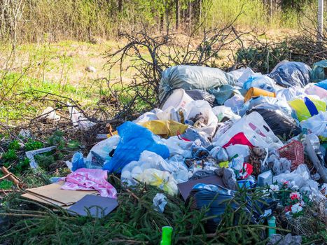 large garbage dump in the forest, environmental pollution by waste