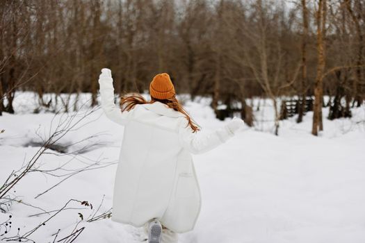 woman Walk in winter field landscape outdoor entertainment winter holidays. High quality photo