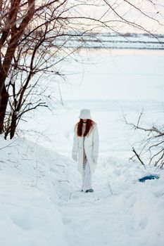 young woman winter clothes walk snow cold vacation nature. High quality photo