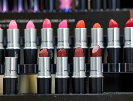 MAC Cosmetics lipstick on the stand. MAC lipstick testers displayed in a luxurious store. Excellent lipstick with a creamy formula, saturated pigments. 12,02,2022, Dubai, UAE.