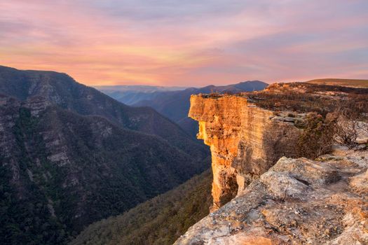 Magnificent cliff escarpment and deep valley views with sunset sky. Australia