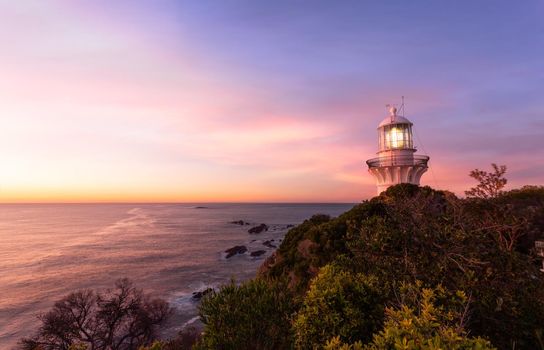 Beautiful light of sunrise over the Sugarloaf Point lighthouse at Seal Rocks which was completed in 1875.