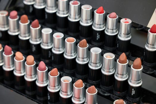MAC Cosmetics lipstick on the stand. MAC lipstick testers displayed in a luxurious store. Excellent lipstick with a creamy formula, saturated pigments. 12,02,2022, Dubai, UAE.