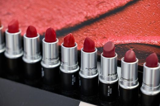 MAC Cosmetics lipstick on the stand. MAC lipstick testers displayed in a luxurious store. Excellent lipstick with a creamy formula, saturated pigments. 12,02,2022, Dubai, UAE.