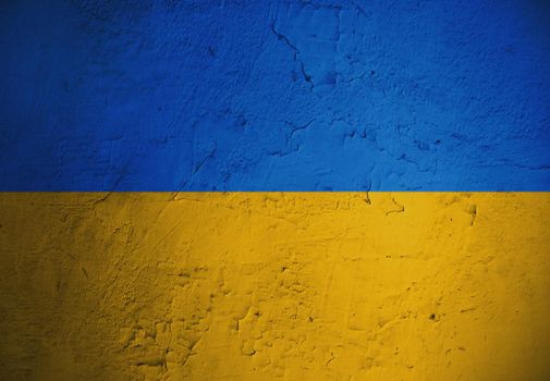 Grungy and damaged wall painted with blue and yellow paint like  Ukrainian flag