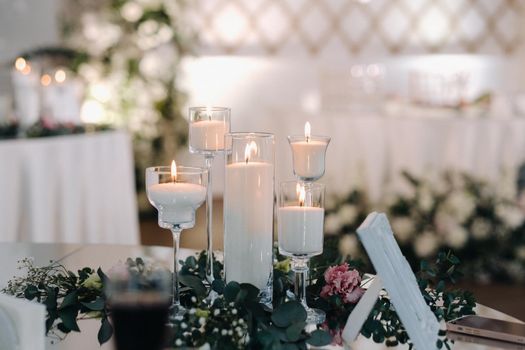 Decorated Table for a wedding reception in a restaurant .Wedding decor.