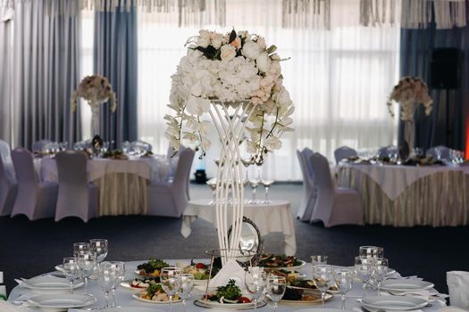 Decorated Table for a wedding reception in a restaurant .Wedding decor.