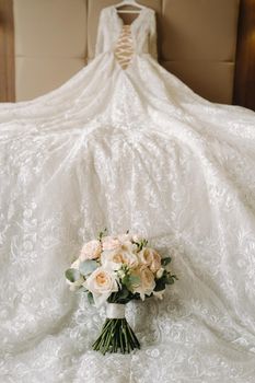 Wedding bouquet of roses lying on the surface. Wedding floristry.