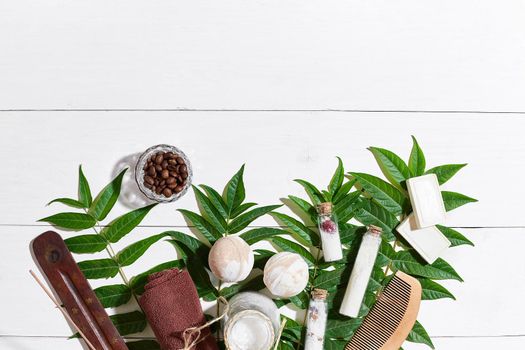 Natural spa and aromatherapy skincare beauty products with bathroom accessories including exfoliating scrubs, oils, sponges, bath bombs and soaps. Top view. Copy space. Still life. flat lay