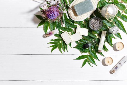 Composition of spa treatment on white wooden table with space for text. Top view. Still life. Flat lay