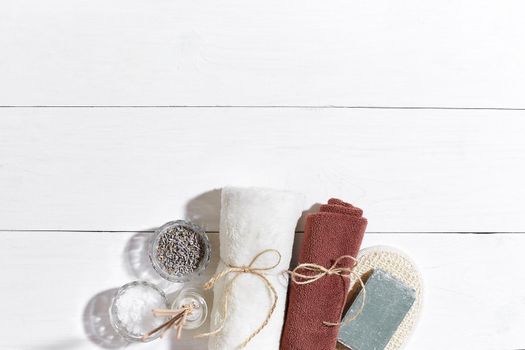 Composition of spa treatment on white wooden table with space for text. Top view. Still life. Flat lay