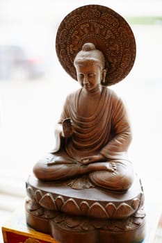 Shot of a statue of a meditating Buddha.