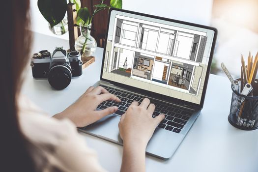 Architects or designers engineers, interior designers, female designers are using home interior design computer programs to send clients to their clients