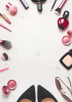 Feminine cosmetic background. Overhead of essentials of a modern woman. Cosmetic objects frame. Instagram filter style