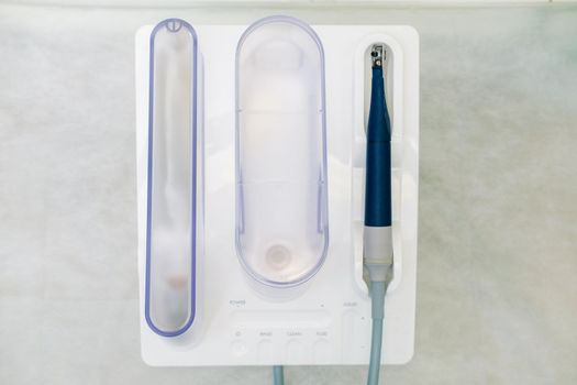 Ultrasonic scaler in the dental office. Dentistry Concept.