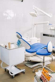 An empty chair in the dentist's office. Empty dentist's office.