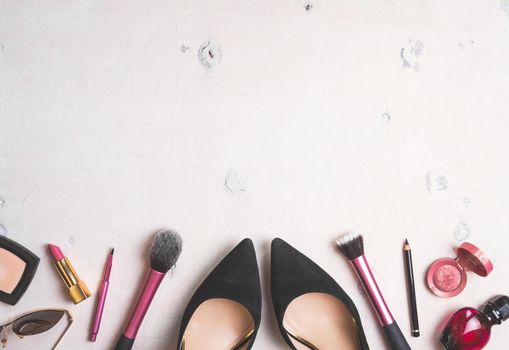 Feminine cosmetic background. Overhead of essentials of a modern woman. Cosmetic objects frame. Instagram filter style