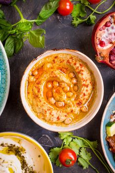 Hummus plate close-up. Hummus, tahini, pitta and buttermilk dip with olive oil. Most famous dishes of middle eastern cuisine
