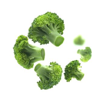 Green broccoli levitating on a white background.