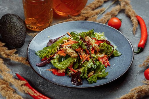 Healthy organic fresh salad with tomatoes, peppers and chicken Masala. Grilled chicken breasts and fresh vegetables in plate.