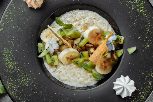 Quinoa porridge with banana, blueberry and pecan nuts for breakfast.