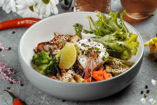 Healthy bowl - quinoa salad with tuna, broccoli, avocado on wooden rustic table. top view.