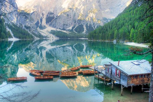 Photographic view of the famous and characteristic the Braies lake in the Italian Dolomites mountain range 