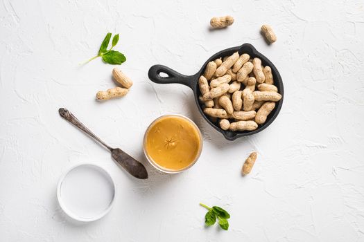 Peanut butter set, on white stone table background, top view flat lay, with copy space for text