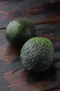Whole pair of green avocado set, on old wooden table
