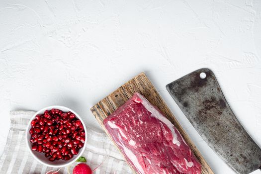 Fresh Raw Beef steak Mignon, with salt, peppercorns, thyme, garlic Ready to cook set, on white stone background, top view flat lay, with copy space for text