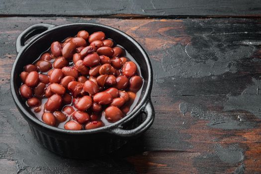 Azuki red beans, on old dark wooden table background with copy space for text