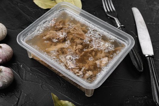 Aspic meat set, on black dark stone table background