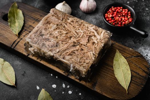 Jellied meat set, on black dark stone table background