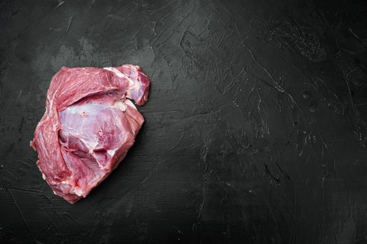 Raw Pork meat shoulder set, on black dark stone table background, top view flat lay, with copy space for text