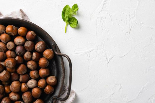 Hazelnut nut health organic brown filbert set, on white stone table background, top view flat lay, with copy space for text