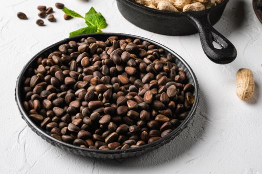 Pine nuts set, on white stone table background