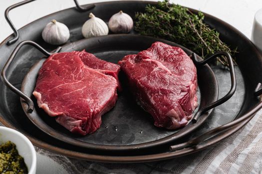 Uncooked Raw rump steak beef meat set, on white stone table background