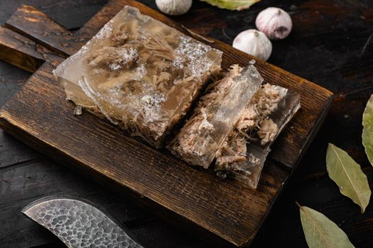 Aspic meat set, on black wooden table background