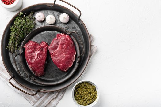 Uncooked Raw rump steak beef meat set, on white stone table background, top view flat lay, with copy space for text