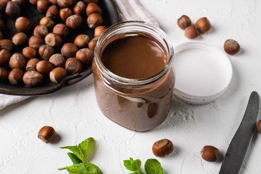 Chocolate Hazelnut Spread set, on white stone table background