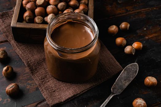 Chocolate Hazelnut Spread set, on old dark wooden table background