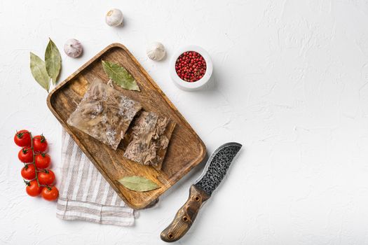 Homemade jelly meat with mustard and horseradish set, on white stone table background, top view flat lay, with copy space for text