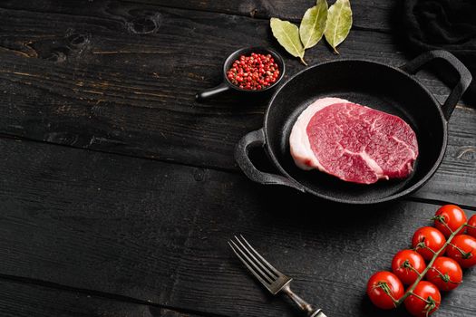 Fresh beef steak sliced set, on black wooden table background, with copy space for text